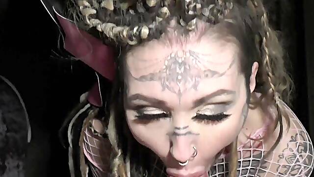 A woman in a fishnet mask has intense sex