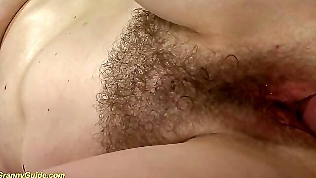 Bald man is fucking a slutty, Hungarian granny on the sofa and listening to her moans