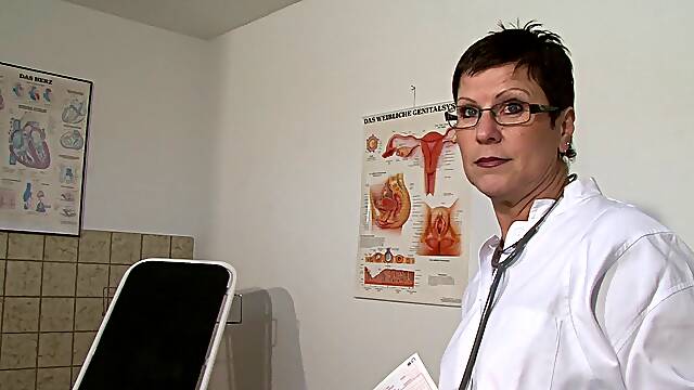 Mature European doctor dildoing her old cunt in the hospital