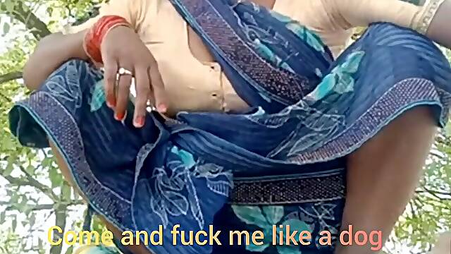 Asking enjoyment outdoor in the farm sitting wearing saree .