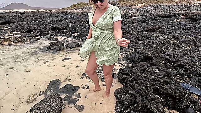 Desperate girl’s pee into the water outdoors